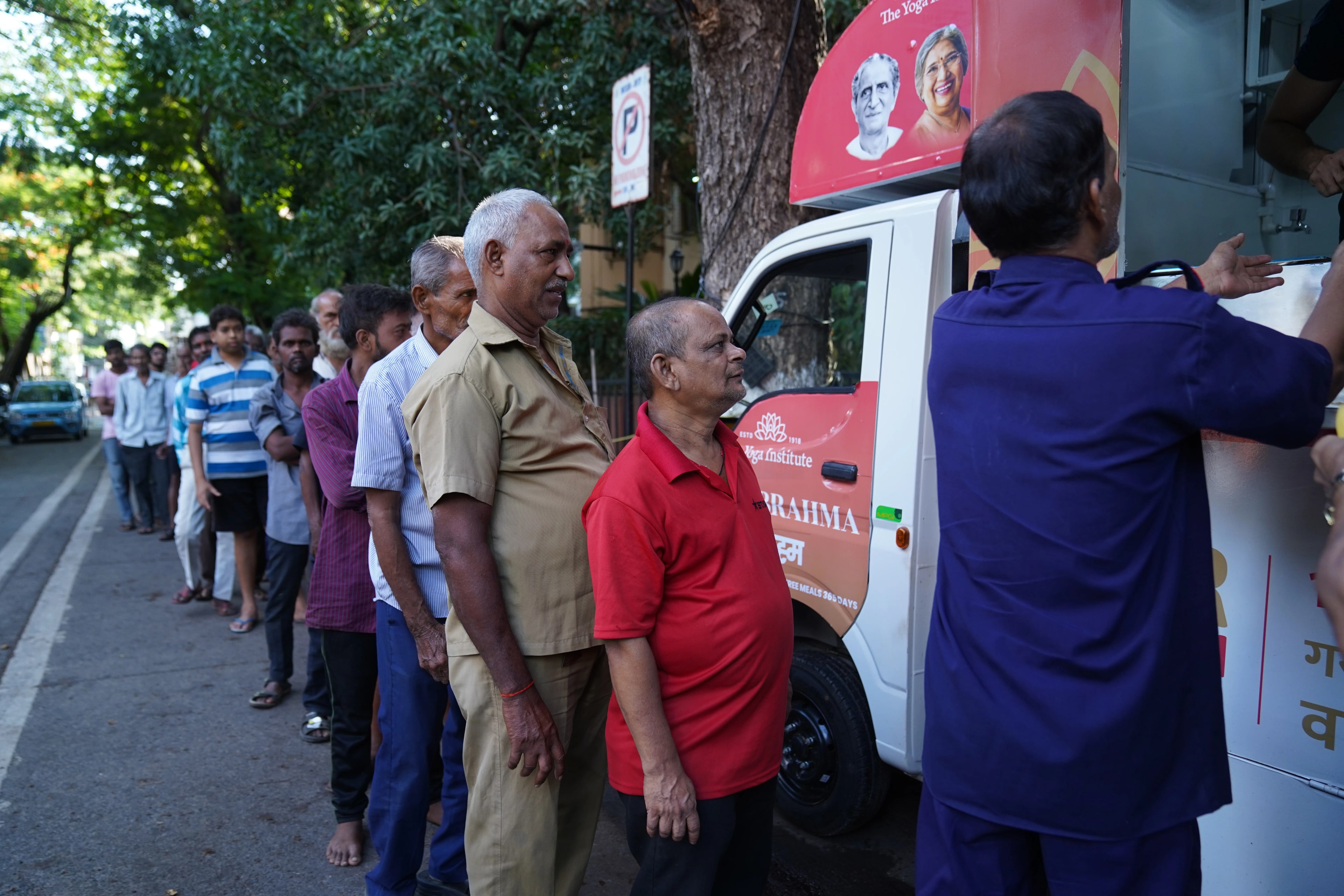 Volunteers sharing food at Annam Brahma