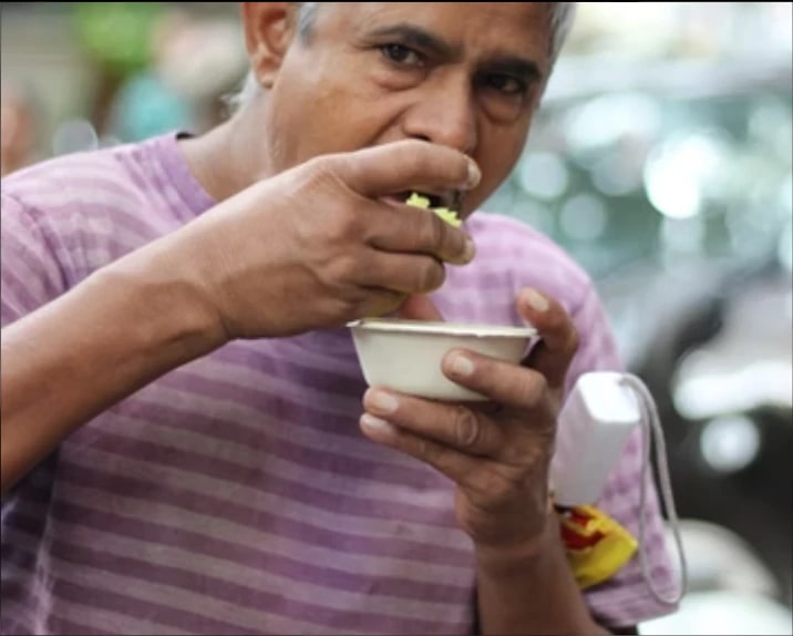 Elderly man eating