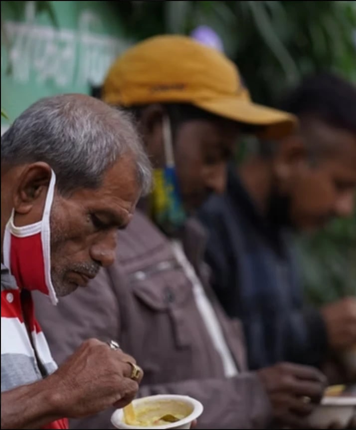 Two older men and young girl