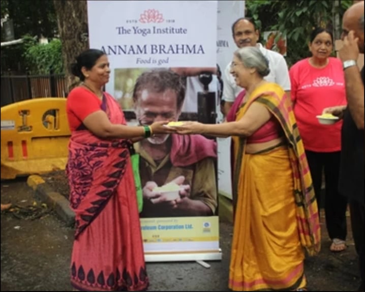 Volunteers sharing food at Annam Brahma